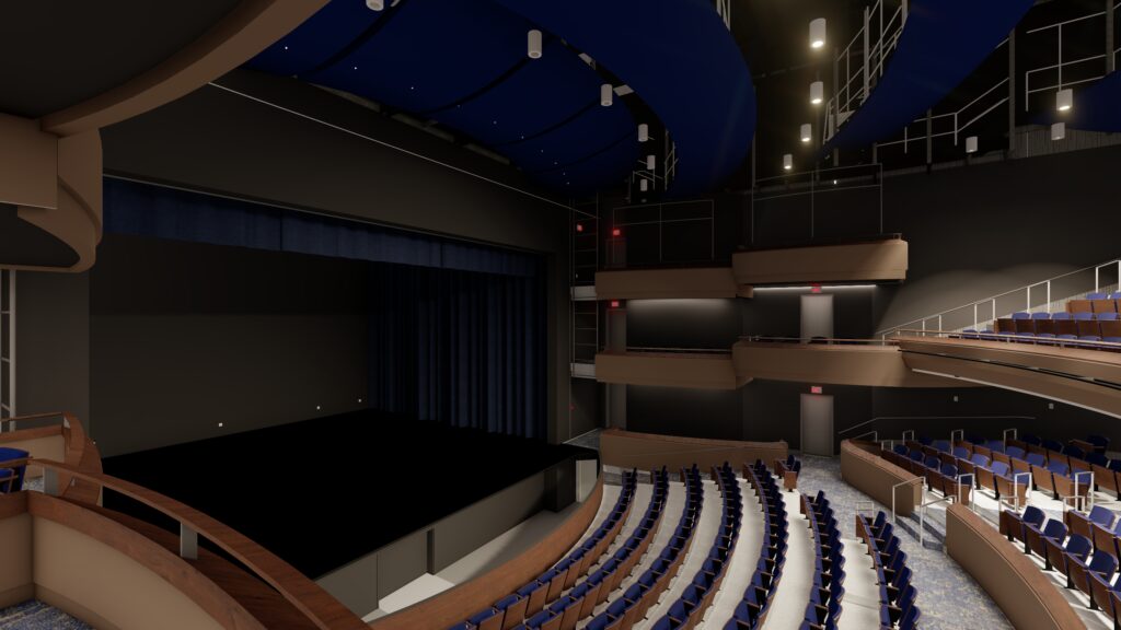 Interior view of a modern theater with a stage, blue ceiling, and seating areas, showcasing the venue's design for performances and events in Lawrenceville, GA.