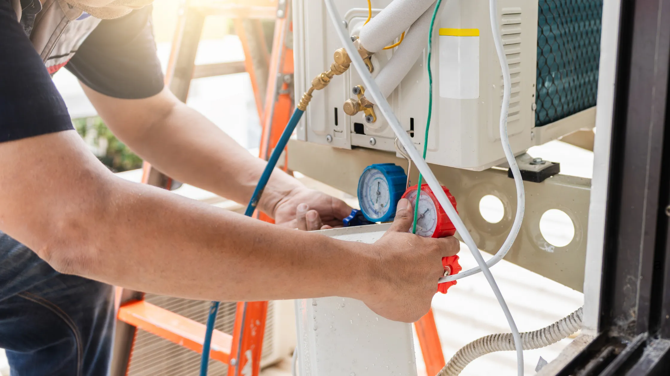 HVAC technician performing heat pump maintenance with pressure gauges and tools, emphasizing expert repair services for Lawrenceville homeowners.